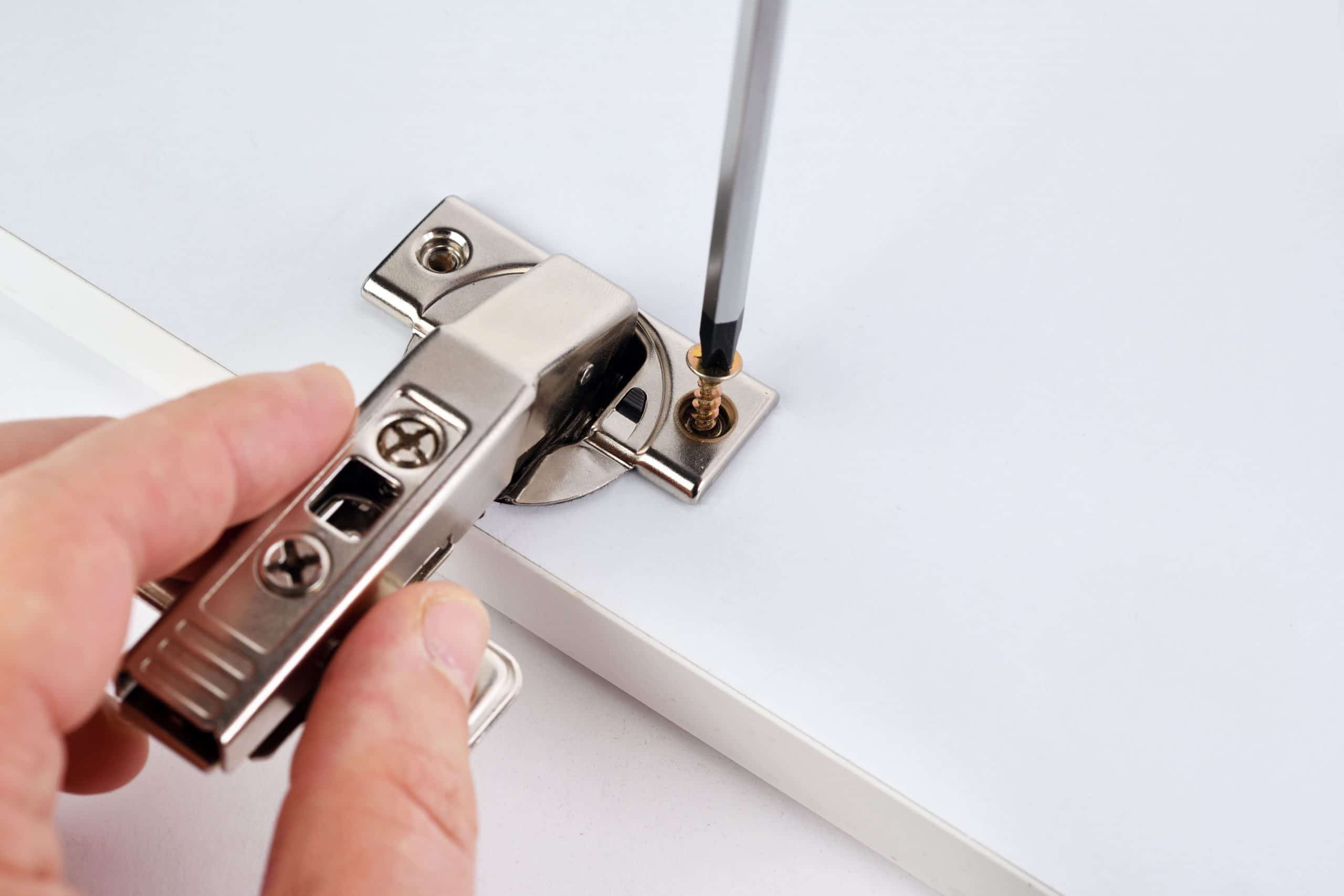 how to adjust kitchen cabinet hinges